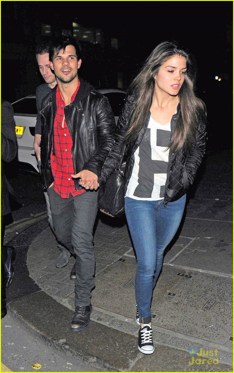 taylor lautner marie avgeropoulos matching jackets london 04